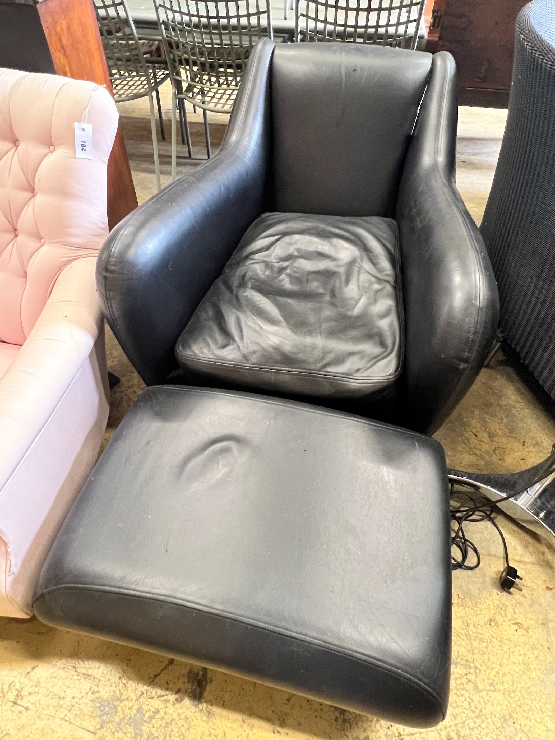 A Matthew Hilton black leather Balzac armchair, width 82cm, depth 100cm, height 82cm and a footstool